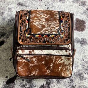 Cowhide and Tooled Leather Western Backpack – Rustic Brown & Cream Hide with Hand-Carved Design