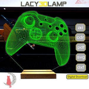 Puede incluir: Modelo 3D de alambre verde de un mando de videojuego en una base de madera. La imagen incluye el texto "LACY3DLAMP" y "Descarga digital".