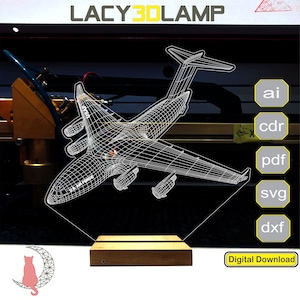 May include: A digital download of a 3D model of a C-17 Globemaster III aircraft. The model is in a wireframe style and is shown on a wooden base. The image also includes the text "LACY3DLAMP" and "Digital Download".