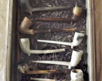 Antique collection of nicely displayed civil war era tobacco/ pipes