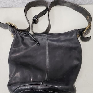 Vintage Coach black leather shoulder bag authenticated