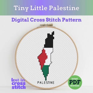 May include: A cross-stitch pattern of the Palestine map, featuring black, white, red, and green colors, is displayed within a wooden embroidery hoop. The text "Tiny Little Palestine" and "Digital Cross Stitch Pattern" are at the top. The words "lost in cross stitch" and "PALESTINE" are also visible.