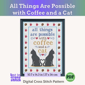 Op de afbeelding: Een ingelijst kruissteekpatroon met de tekst All Things Are Possible with Coffee and a Cat. Het ontwerp bevat twee zwarte katten-silhouetten met staarten die een hart vormen, rode hartjes, koffiemokken en koffiebonen in een rand.