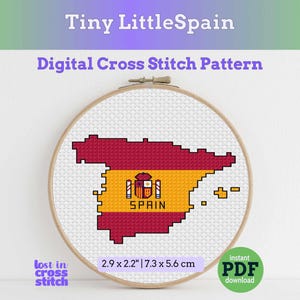 May include: A digital cross stitch pattern in a wooden hoop featuring a pixelated map of Spain in red and yellow with the national coat of arms and the text SPAIN. The design measures 2.9 by 2.2 inches. Text includes Tiny LittleSpain and lost in cross stitch.