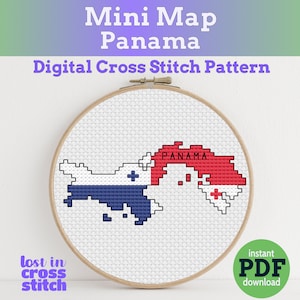 Puede incluir: Una taza de cerámica blanca con asa negra y el texto "But First, Coffee" en negrita negra. La taza se encuentra sobre un fondo borroso, sugiriendo un ambiente acogedor.