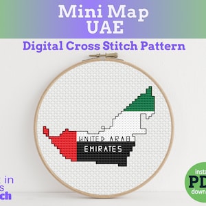 May include: A cross-stitch embroidery hoop featuring a pixelated map of the United Arab Emirates. The map is in the colors of the UAE flag: red, white, green, and black. Text on the image reads "Mini Map UAE" and "Digital Cross Stitch Pattern."