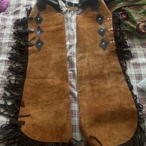 Western Women Chap, Buckskin Chap, Rodeo chap, Mountain Chap, Chinks chap, Women riding chaps, Ladies fringed chap, Gift for her, Women Leather pant, Ladies Chinks Chaps, Ladies western chap, Riding chap, Rodeo Mountain chap

horse riding gifts, Equestrian gifts, Horse gifts, Custom horse gifts, western wear women, Rodeo, leather chap, Hand made, cowgirl birthday, cowgirl outfit, women western wear, chaps and chinks, 
cowgirl chap