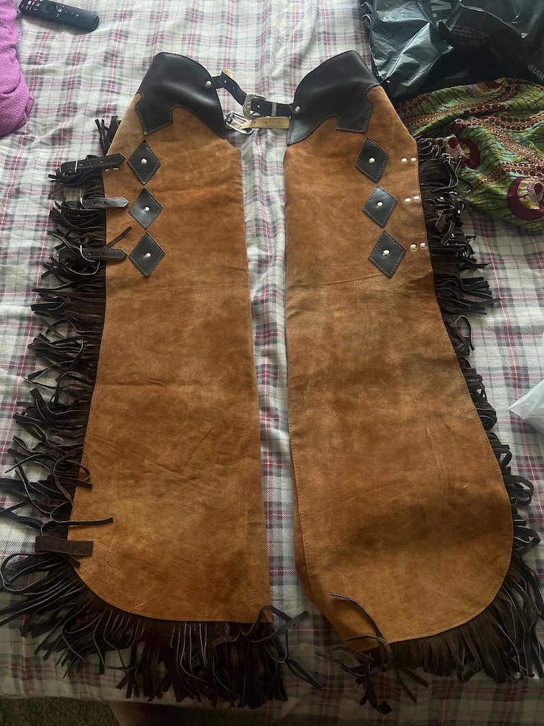 Western Women Chap, Buckskin Chap, Rodeo chap, Mountain Chap, Chinks chap, Women riding chaps, Ladies fringed chap, Gift for her, Women Leather pant, Ladies Chinks Chaps, Ladies western chap, Riding chap, Rodeo Mountain chap

horse riding gifts, Equestrian gifts, Horse gifts, Custom horse gifts, western wear women, Rodeo, leather chap, Hand made, cowgirl birthday, cowgirl outfit, women western wear, chaps and chinks, 
cowgirl chap