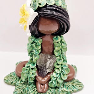6. Fluorite crystal island girl with leaf lei