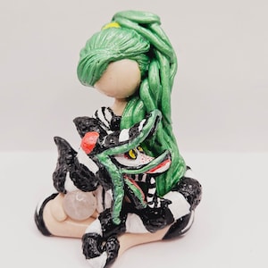 Beetle gender bender female Beetle holding pet sand worm green hair