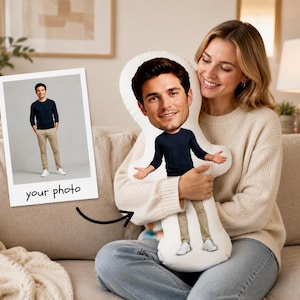 May include: A custom photo pillow featuring a person's face and body. The pillow has a white background and the person is wearing a navy blue long-sleeve shirt, khaki pants, and white shoes. The photo is on a polaroid-style card with the text "your photo".
