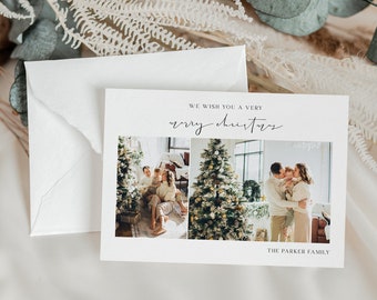 May include: A white Christmas card with a photo of a family of three standing in front of a Christmas tree. The card reads "We wish you a very merry Christmas" and "The Parker Family".