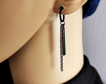 Svarta örhängen med hängande stift, utan hål