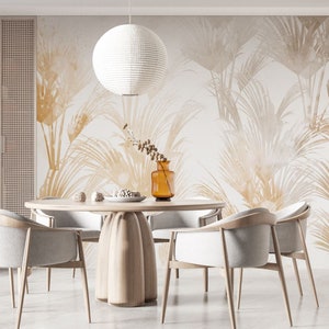 May include: A dining room with a round wooden table and six white chairs. The wall behind the table has a beige and brown wallpaper with a pattern of palm leaves. A white paper lantern hangs from the ceiling above the table.