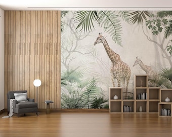 May include: A living room interior design with a wall mural featuring two giraffes standing in a lush green jungle. The mural is a light beige color with green foliage and a wooden bookshelf with books and decorative items.