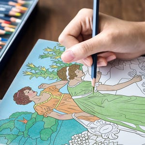 May include: A person coloring a coloring book with two women in dresses and flowers. The woman is using a blue colored pencil to color the dress of one of the women.