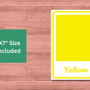 May include: A yellow color card with the word "Yellow" printed on it. The card is 5x7 inches and is on a wooden background.