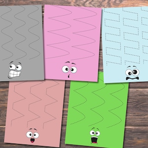 May include: Five colorful sheets of paper with zig-zag lines and cartoon faces. The sheets are gray, pink, light blue, rose, and green. The lines are dotted, and the faces have different expressions.