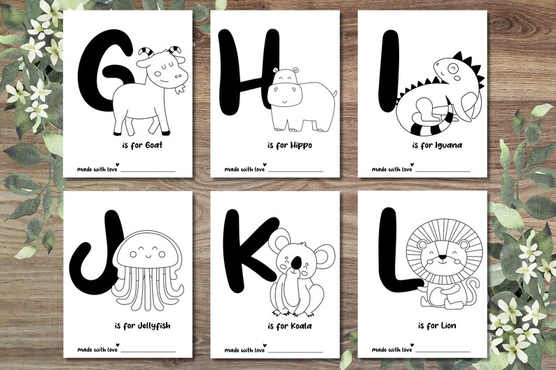 May include: Black and white printable alphabet flashcards featuring a different animal for each letter. The letters are in a bold, blocky font. The animals include a goat, hippo, iguana, jellyfish, koala, and lion.