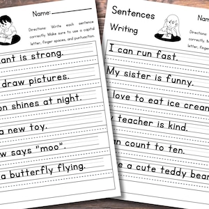 May include: Two white educational worksheets titled Sentences Writing with black text and line guides for handwriting practice. The pages feature illustrations of children writing and include sentences like The elephant is strong and I can run fast.