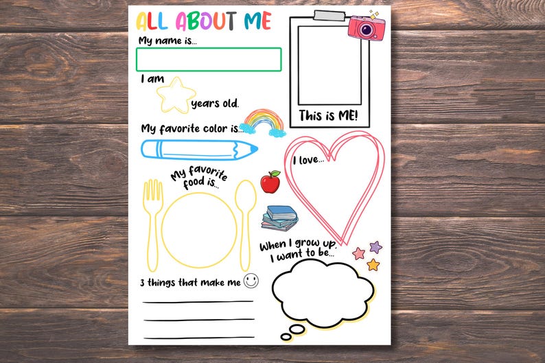 May include: A colorful "All About Me" worksheet with prompts for self-expression. Includes spaces for name, age, favorite color, food, and aspirations. Features a photo frame, heart, and thought bubble, all on a wooden background.