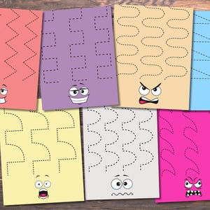 May include: A collection of colorful activity sheets with cartoon faces and dotted lines for tracing. Each sheet features a different color, including pink, purple, yellow, beige, blue, gray, and fuchsia. The faces display various expressions.