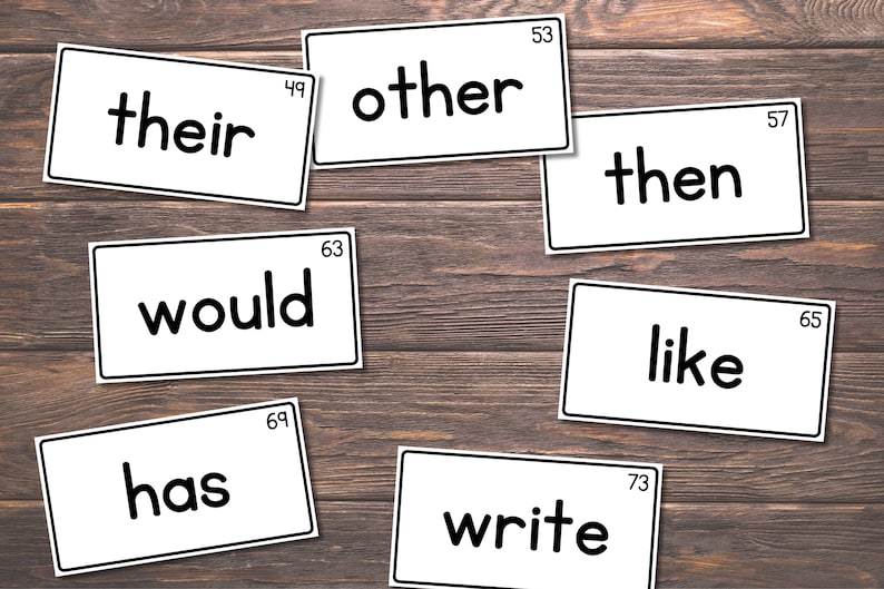 May include: A set of 10 white flash cards with black text. The words on the cards are "their", "other", "then", "would", "like", "has", "write".