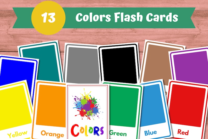 May include: 13 color flash cards with a variety of colors including red, orange, yellow, green, blue, purple, brown, black, and gray. The cards are arranged in a semi-circle on a wooden surface.