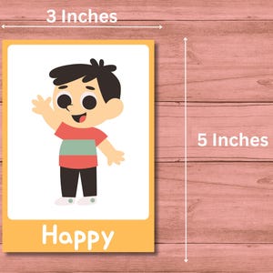 May include: A yellow and white card with a cartoon illustration of a person with black hair and a red shirt with a green stripe. The card says "Happy" at the bottom. The card is 3 inches wide and 5 inches tall.