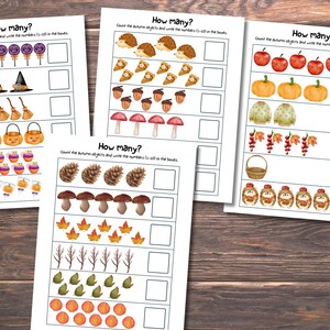 May include: Four educational worksheets titled How many? featuring rows of autumn-themed illustrations including lollipops, witch hats, brooms, pumpkins, hedgehogs, pie slices, acorns, mushrooms, apples, sweaters, leaves, branches, and baskets with empty boxes.