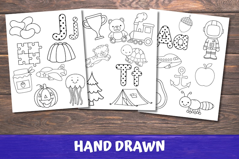 May include: Black and white printable colouring pages featuring the alphabet letters J, T, and A with various illustrations.  The letters are decorated with polka dots.  The illustrations include a jelly, a plane, a pumpkin, a jellyfish, a tree, a trophy, a teddy bear, a train, a turtle, a tent, an aeroplane, an anchor, an apple, and an astronaut.