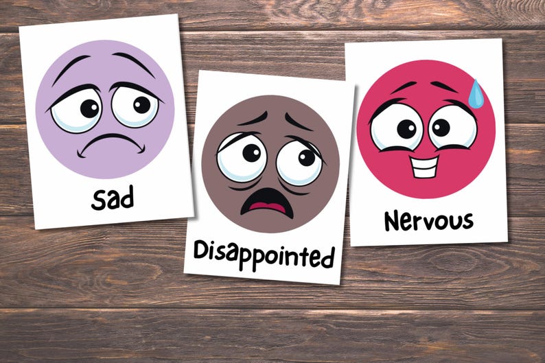 May include: Three cards with cartoon faces representing emotions. The first card shows a sad face in a purple circle with the word "sad". The second card has a disappointed face in a brown circle. The third card shows a nervous face in a pink circle with the word "Nervous".