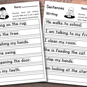 May include: Two white educational worksheets titled Sentences Writing with black text and illustrations of children. Each page features lined spaces for students to practice writing sentences like I am sitting on the rug and He walks to school.
