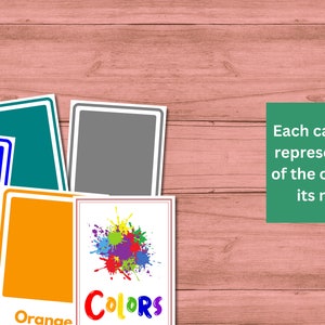 May include: A set of color cards with the word "COLORS" on one card and the names of the colors on the other cards. The colors are yellow, orange, blue, green, and gray.