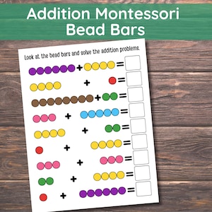 May include: A worksheet for addition problems with colorful bead bars. The text at the top reads "Addition Montessori Bead Bars." The worksheet includes addition problems with blank spaces for answers. The background is a wooden surface.