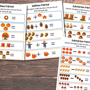 May include: Three educational worksheets featuring autumn-themed math problems. Two sheets are titled Addition Practice with illustrations of wreaths, pumpkins, trees, squirrels, mushrooms, leaves, pinecones, acorns, scarecrows, and mugs. One sheet is Subtraction Practice.