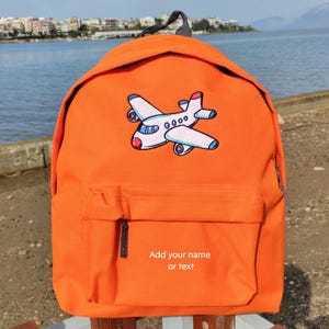 Avion et nom ou texte sur le sac à dos, personnalisé, brodé à la machine, idéal pour l'école, les activités de plein air