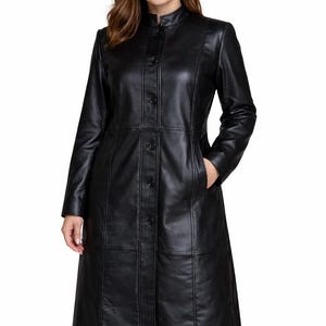 May include: A rustic wooden sign with the text "Welcome to our home" in white lettering. The sign features a distressed finish and a simple, inviting design, perfect for entryway decor.