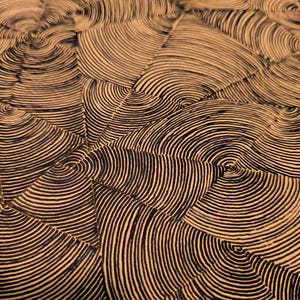May include: Abstract pattern featuring concentric semi-circles in black against a tan background. The design creates a textured, wave-like effect, with the semi-circles radiating from central points.
