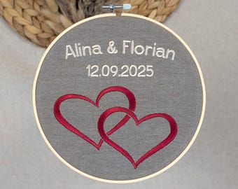 Personalized wedding gift • Embroidered with names and wedding date • Hearts in an embroidery frame for the bride and groom • Embroidery frame picture