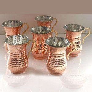 Può includere: Set di sei tazze in rame martellato con manici dorati. Le tazze hanno un design tradizionale turco e sono perfette per servire bevande.
