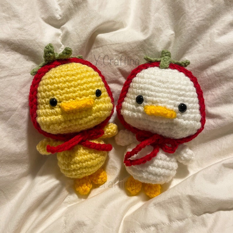 Crochet Duck Plushie wearing (Frog, Bee, Strawberry) Hat image 1