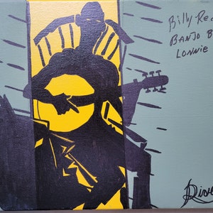 May include: A black and yellow painting of a person playing a banjo. The painting is signed "Billy Redden BANJO BOY Lonnie" and "Diover".