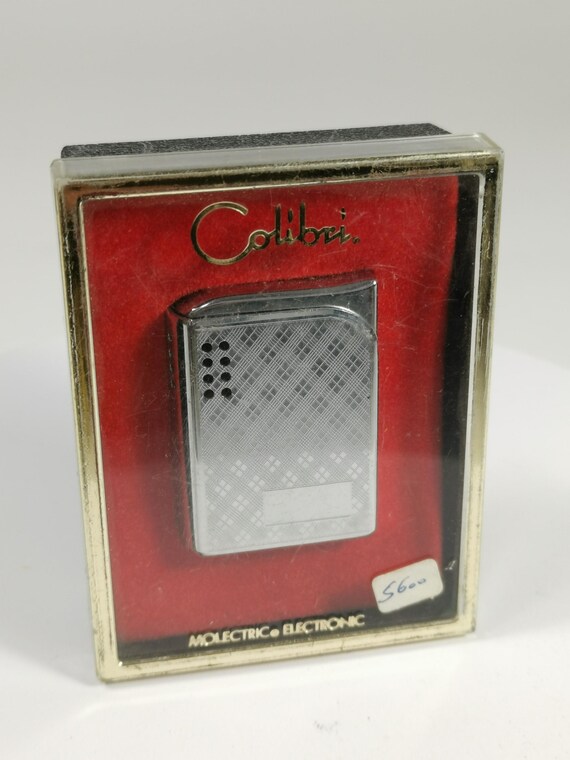 colibri cigarette lighter Molectric Electronic Lighter-tobacco Tobacciana W/design(not Tested) Enhance your everyday elegance with the Colibri Heritage Cube Dual Soft and Torch Flame Tabletop Cigar Lighters Colibri Julius Classic Double-Flame Flint