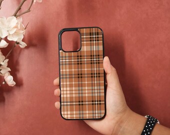 May include: A brown and black plaid phone case with a black border.
