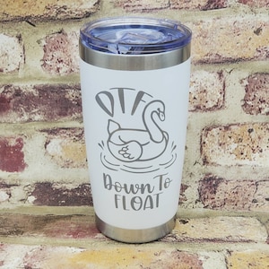 May include: White stainless steel tumbler with a gray graphic of a swan in a pool with the text "DTG Down To Float".