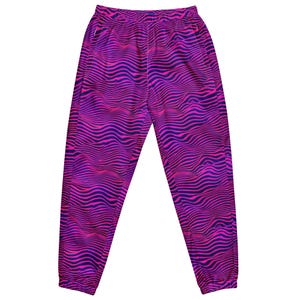 May include: Jogger pants with a vibrant, wavy pattern in shades of pink and purple. The pants have a drawstring waist and pockets. The design resembles a zebra print, creating a bold and eye-catching look. These pants are suitable for casual wear.