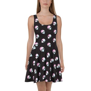 May include: A black skater dress with a pattern of pink and blue alien heads.