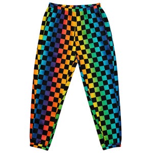 May include: Jogger-style pants with a vibrant rainbow checkerboard pattern. The design features squares in a spectrum of colors, including red, orange, yellow, green, blue, and purple, set against a black background. The pants have an elastic waistband and cuffs.