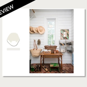 May include: A white room with a wooden table and chairs. The walls are white and the floor is brick. There are baskets and hats hanging on the walls. The text "Credit: Anya Design" is at the bottom of the image.